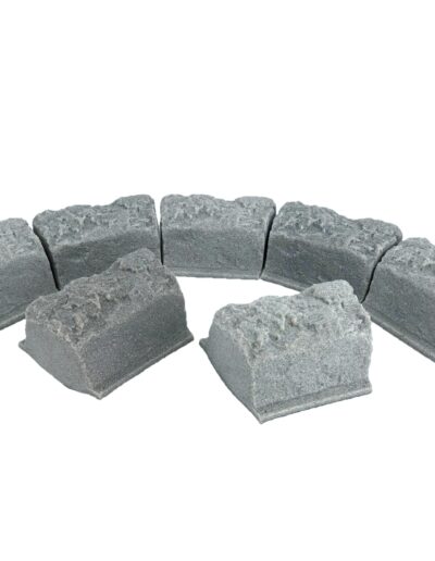 Circular arrangement of gray concrete blocks forming a hollow ring