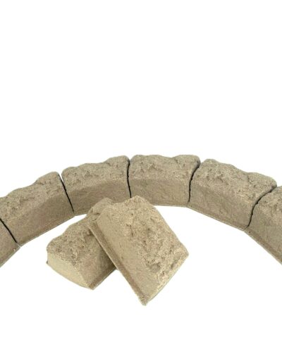 Beige irregular stones arranged in a partial circular ring along the bottom edge of a white background.